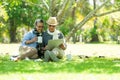 Asian Lifestyle senior couple drinking coffee and shopping online  in the nature park happy and relax time.ÃÂ  Royalty Free Stock Photo